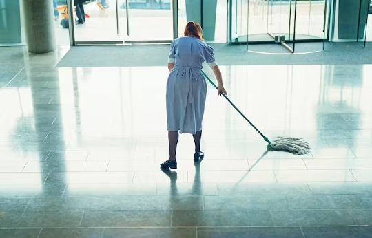 woman mopping floor in a commercial area